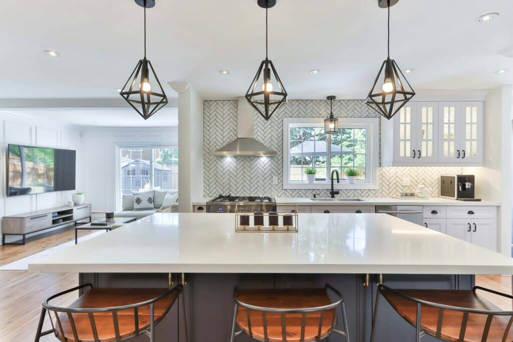 modern kitchen with quartz countertops and hanging pendant lights