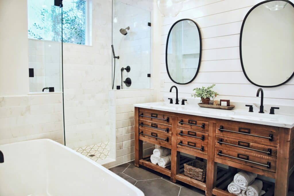 rustic modern bathroom with a reclaimed wood vanity and double sink