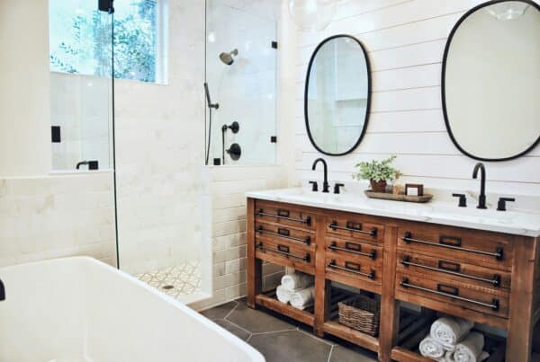 rustic modern bathroom with a reclaimed wood vanity and double sink